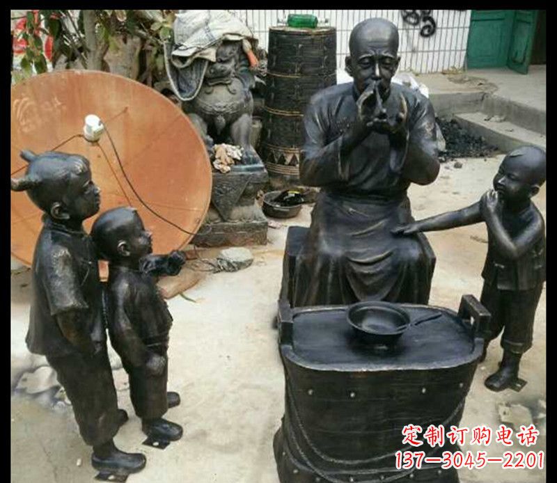 山东步行街吹糖人的人物铜雕