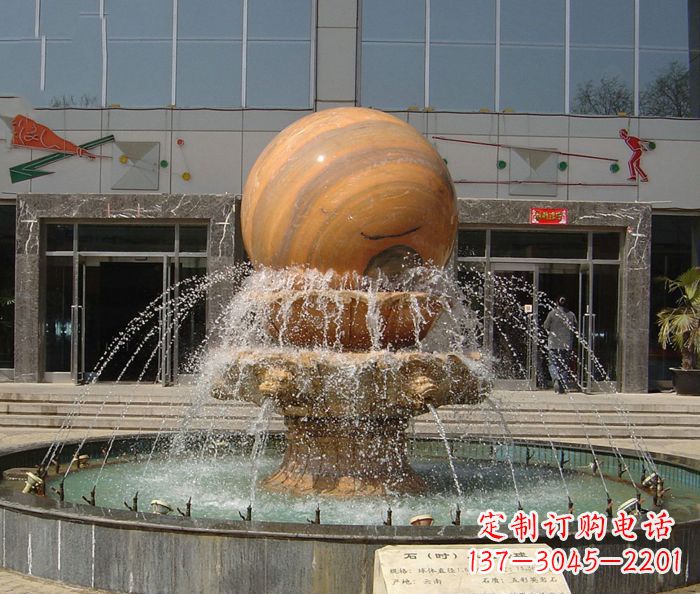 山东石来运转球晚霞红风水球石雕