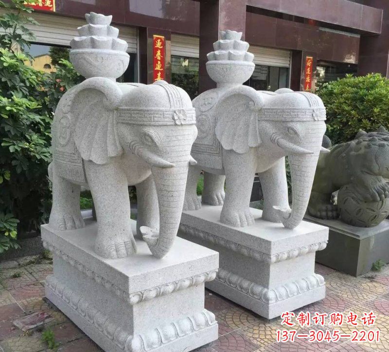 山东驮元宝的大象石雕