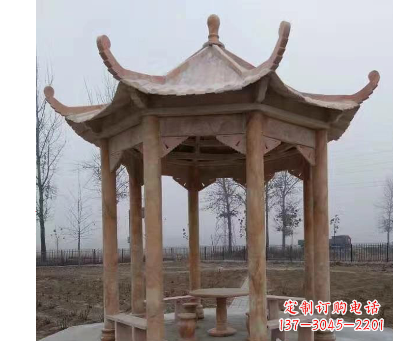 山东公园晚霞红八角石雕凉亭